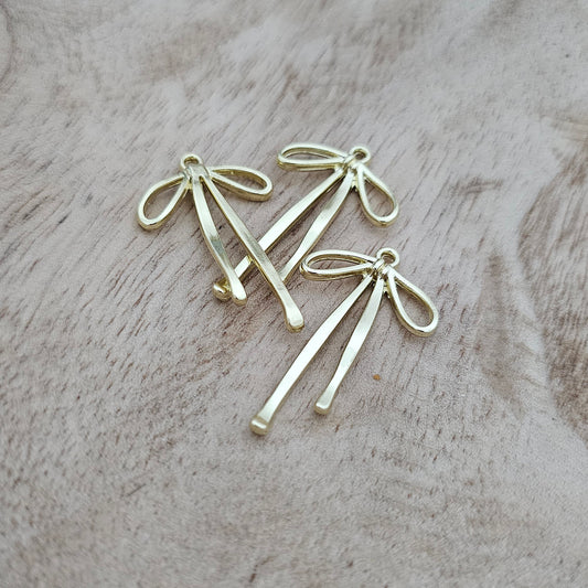 Long Gold Bow Charm