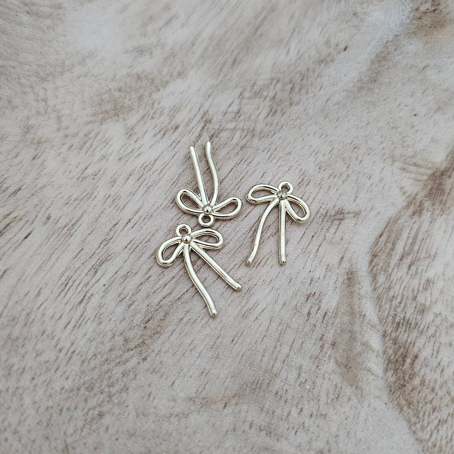 Small Gold String Bow Charm